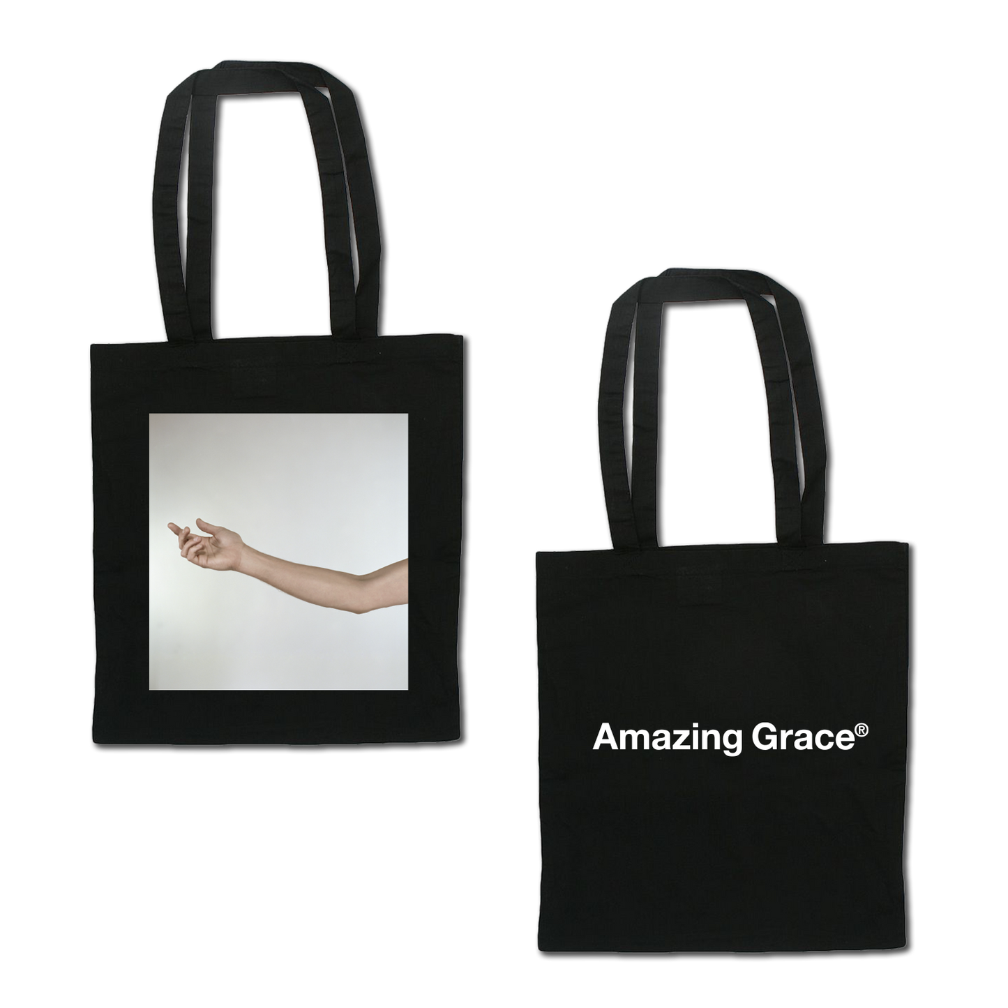 Front and back view of a black tote bag. One side features white ‘Amazing Grace’ text print, and the other side displays the album artwork for Spiritualized’s album Amazing Grace.